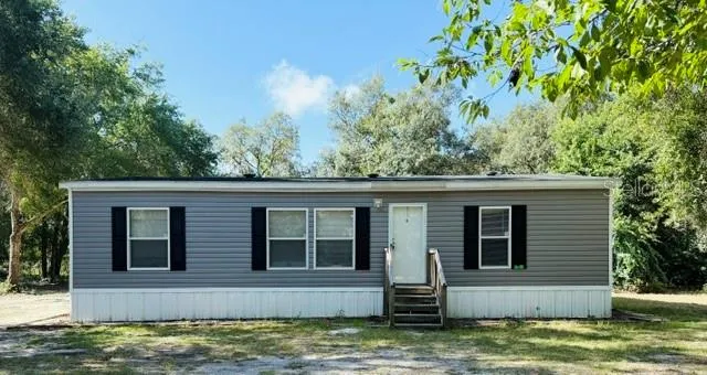 Front elevation beautiful half acre lot