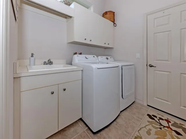 ROOMY LAUNDRY SPACE WITH DEEP UTILITY SINK