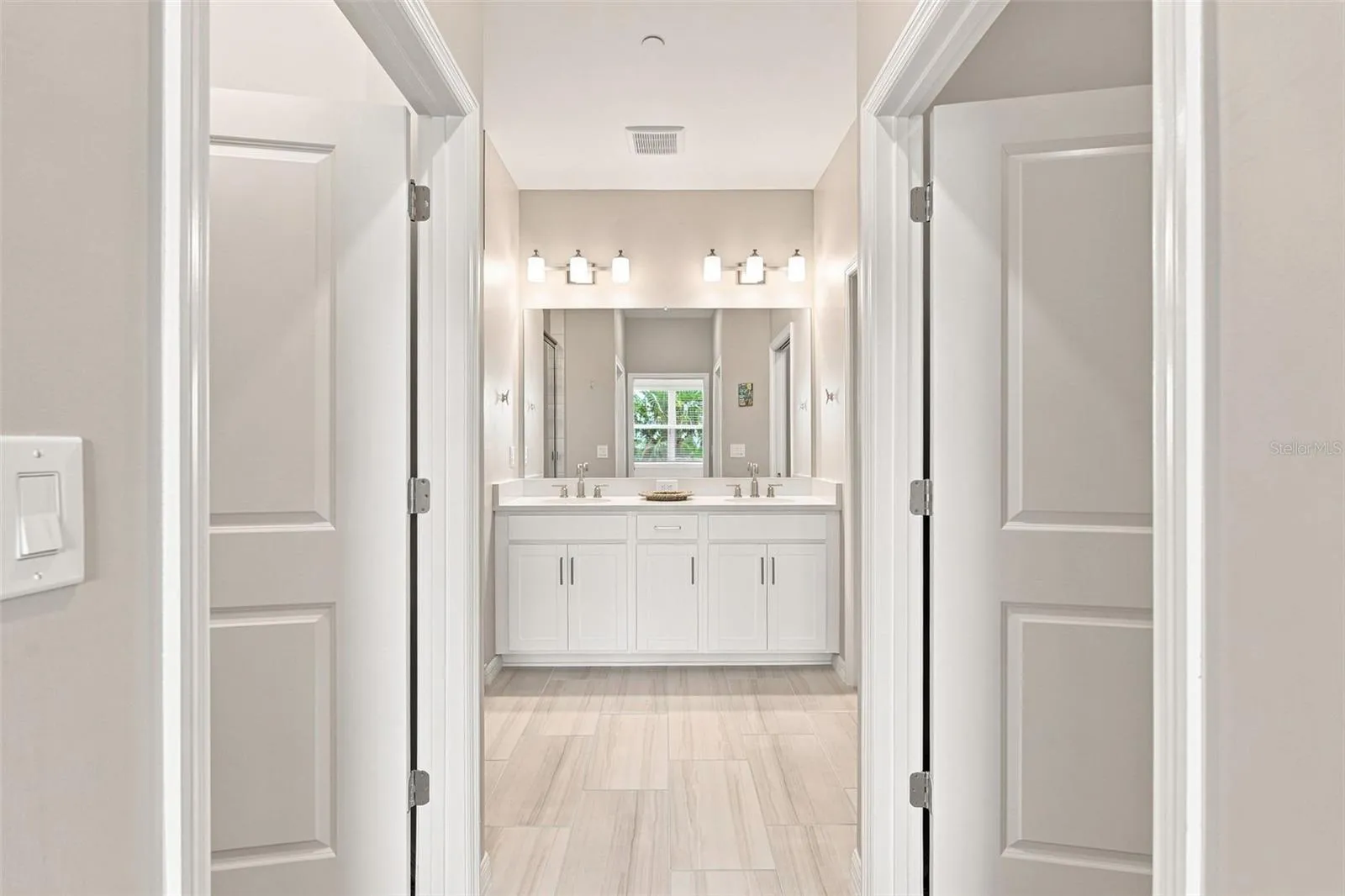 Dual Walk-in Closets Leading to Primary Ensuite