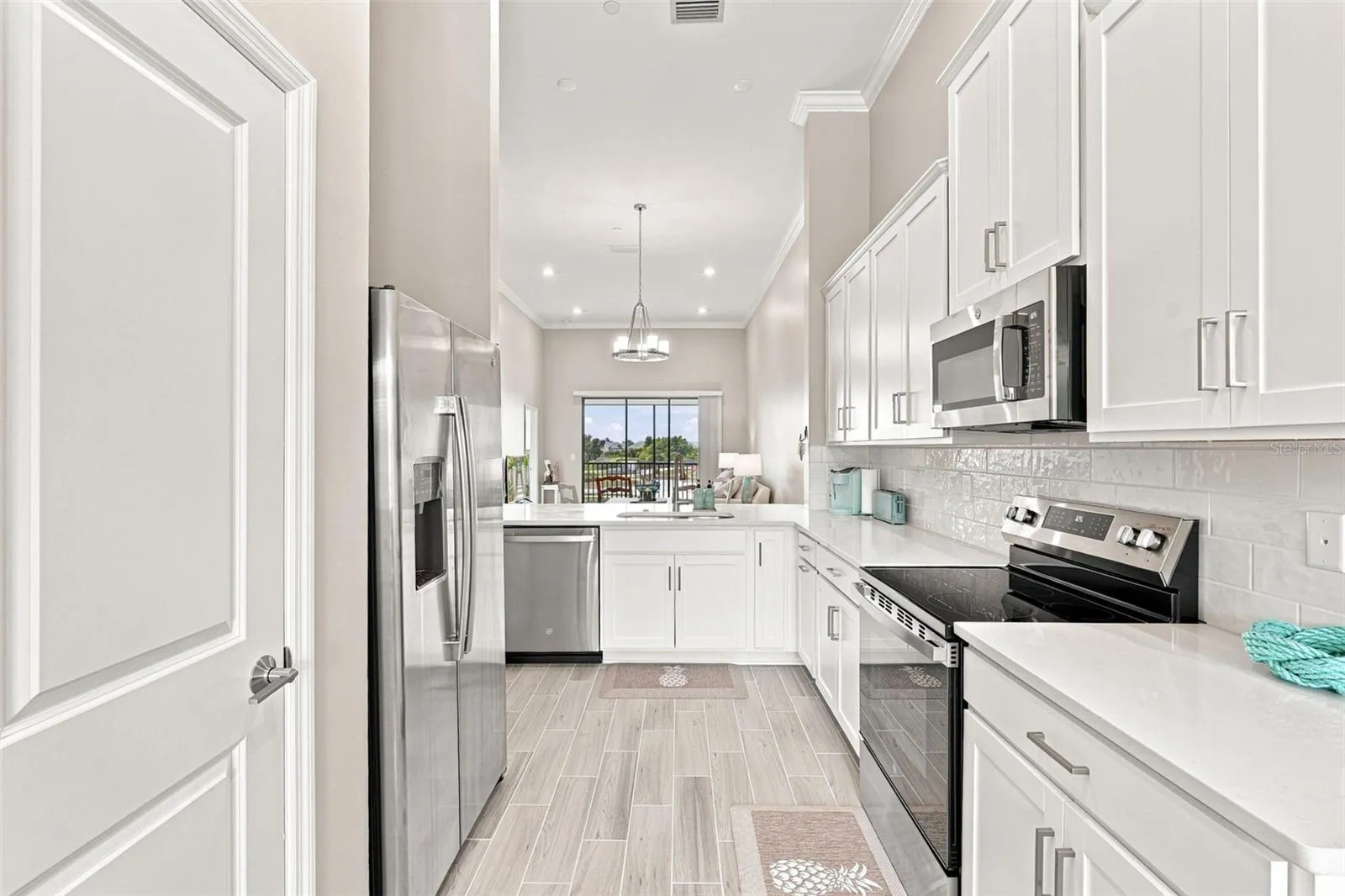 Bright Kitchen Featuring White Cabinetry and Quartz Countertops