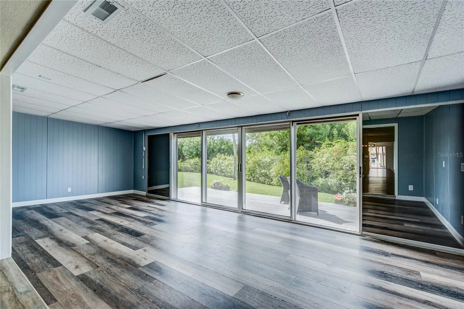 12x26 "Bonus" Florida Room is not included in the official square footage. Sliders pocket to the left and right. Power roll-up storm shutters for protection from the elements.
