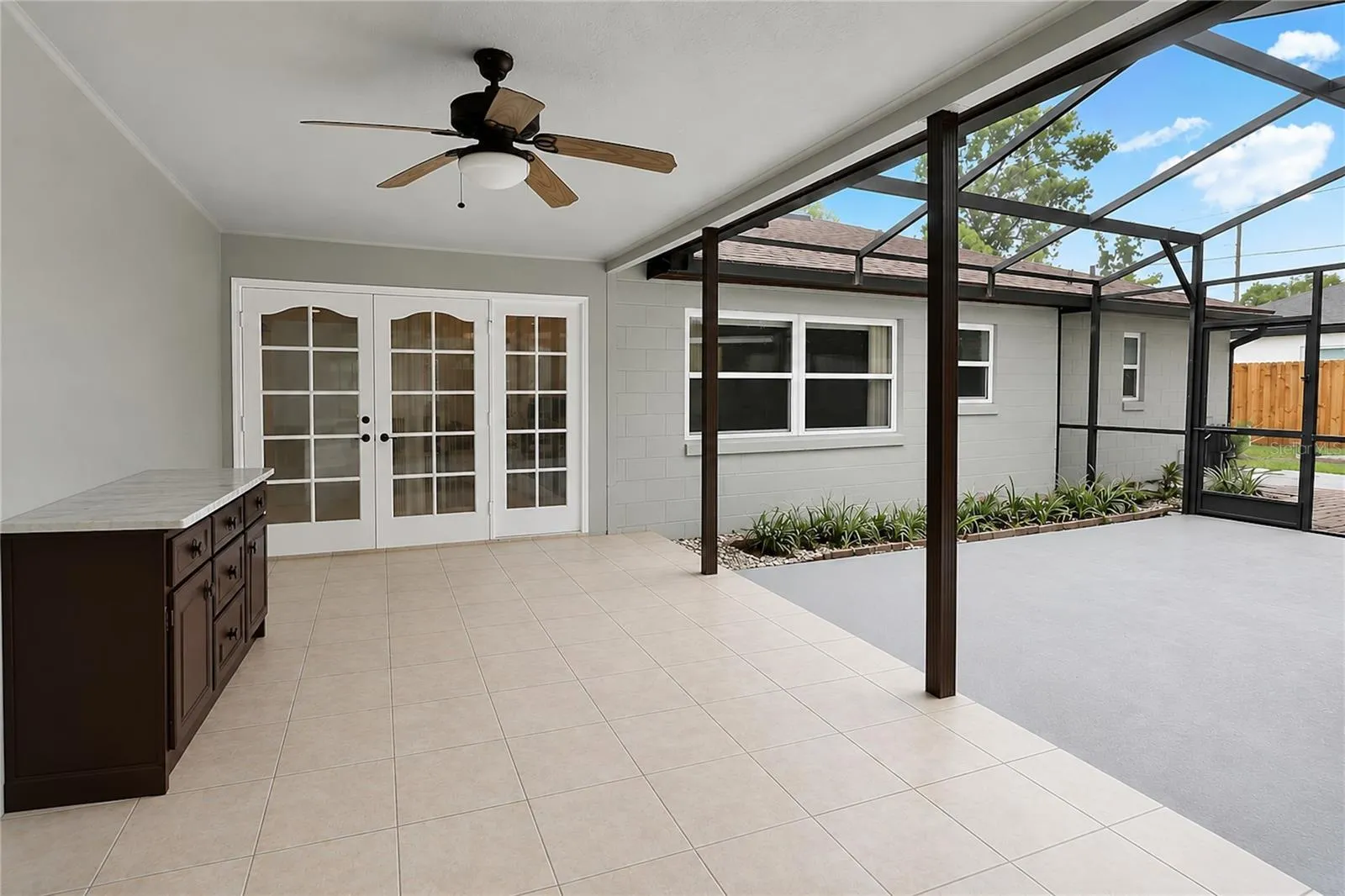 Covered porch is plumbed and wired for your future summer kitchen!
