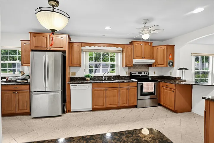Beautiful wood cabinets with plenty of counter space.