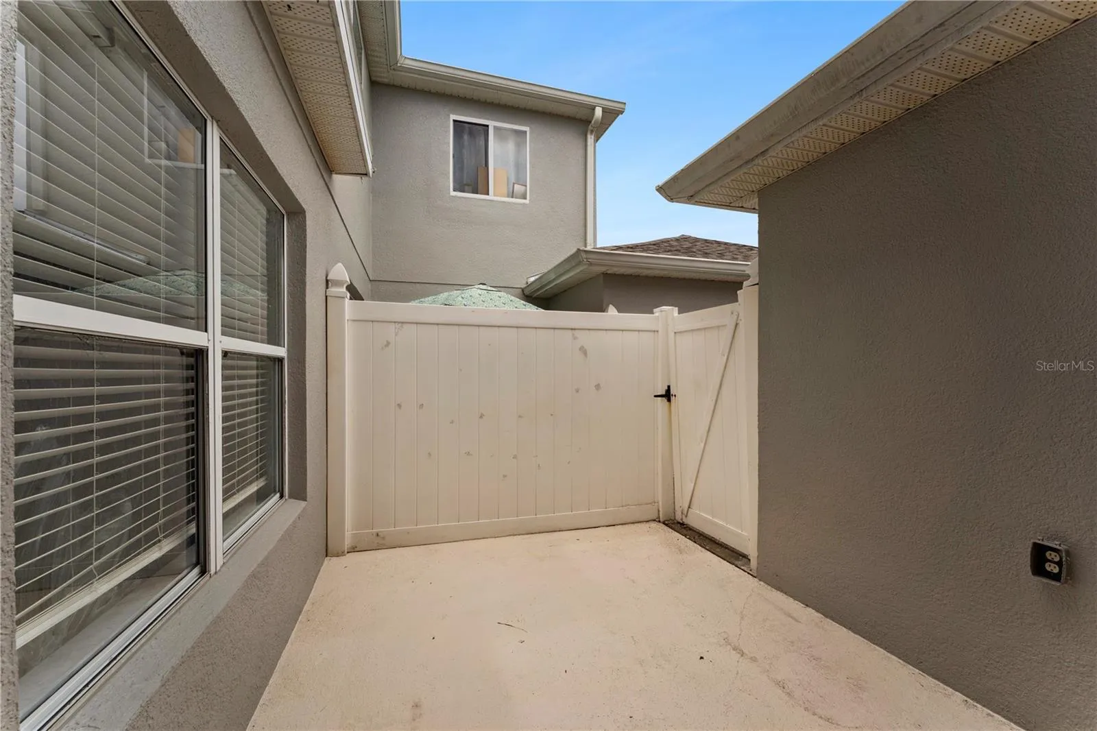 Enclosed private patio with gated access to back