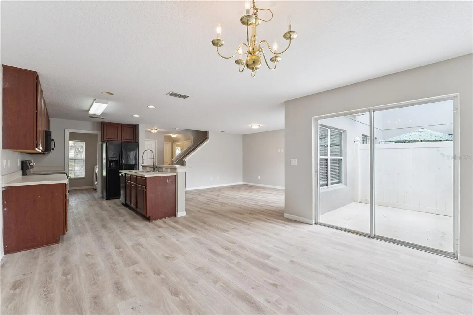 Dining room overlooking patio, kitchen and living room