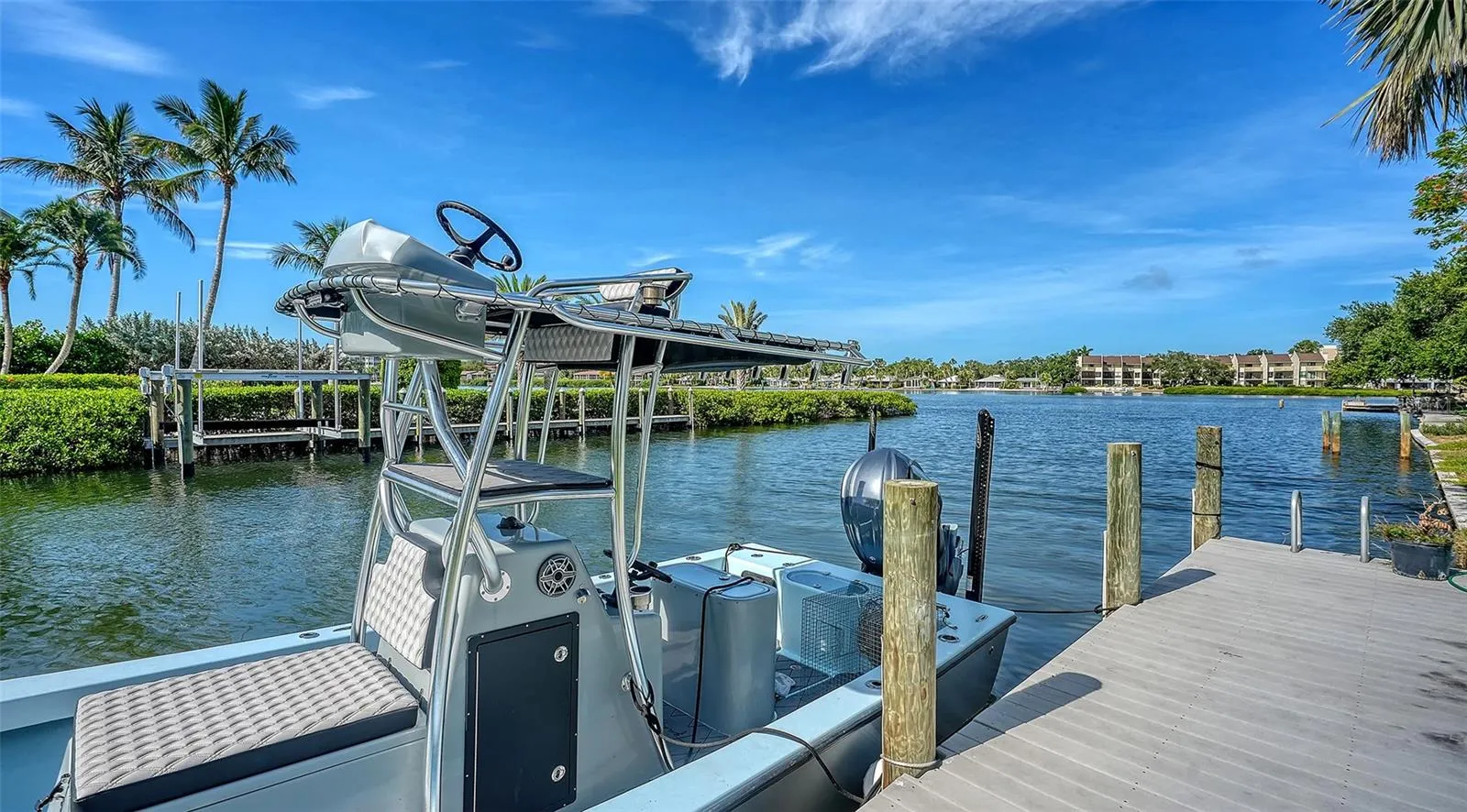 The private dock offers coveted no-bridge access to Sarasota Bay and the Gulf, delivering the effortless waterfront lifestyle that defines luxury coastal living.