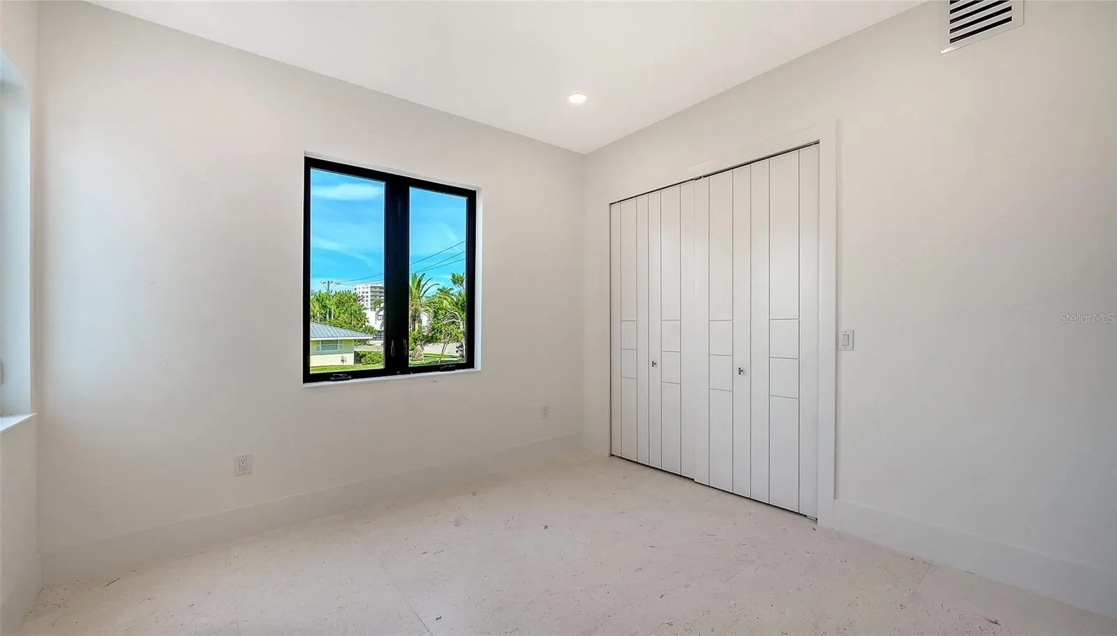 Filled with natural light and overlooking lush tropical surroundings, Bedroom 3 offers a spacious closet and a peaceful retreat.