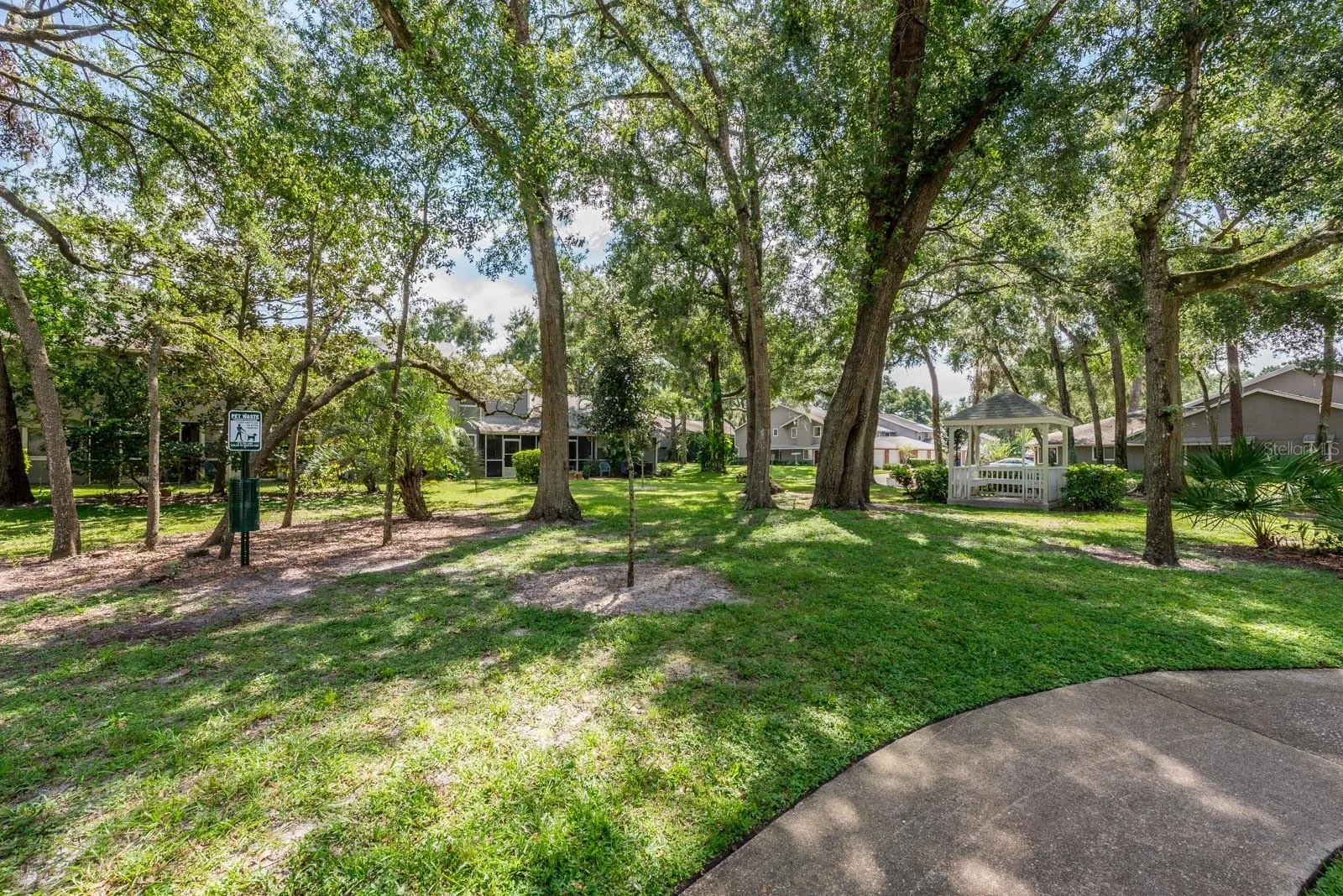 Beautiful park with lots of trees and a gazebo