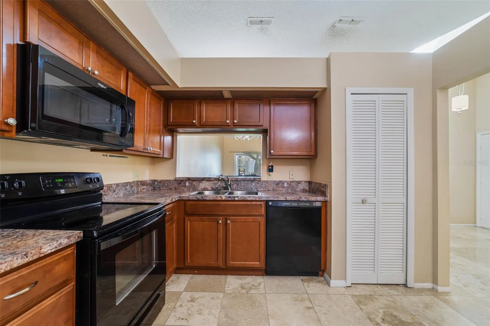 Pass-through window to the dining room plus a 2ND storage closet!