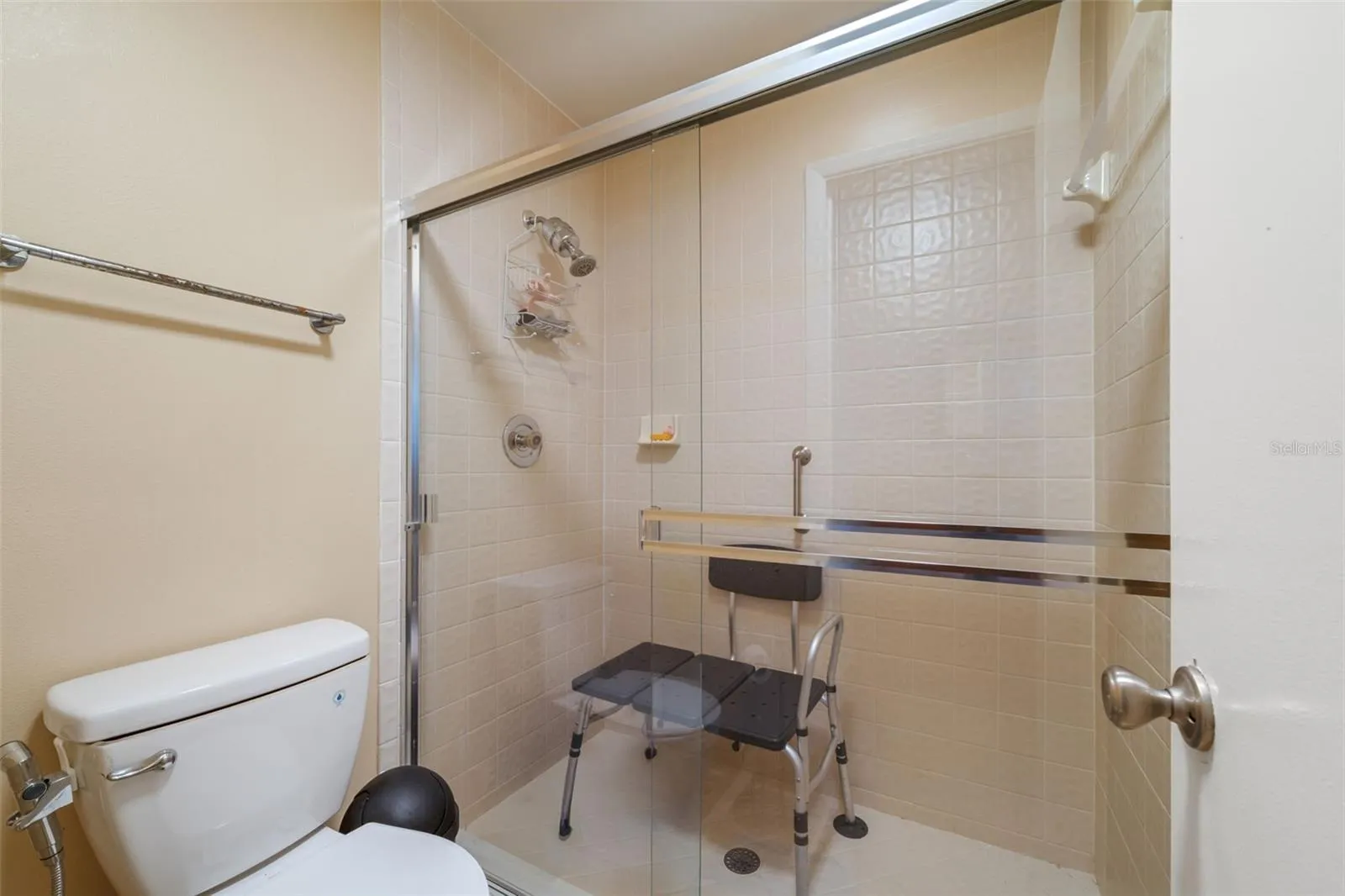 The hall bath has a huge stand-up shower with a sliding door