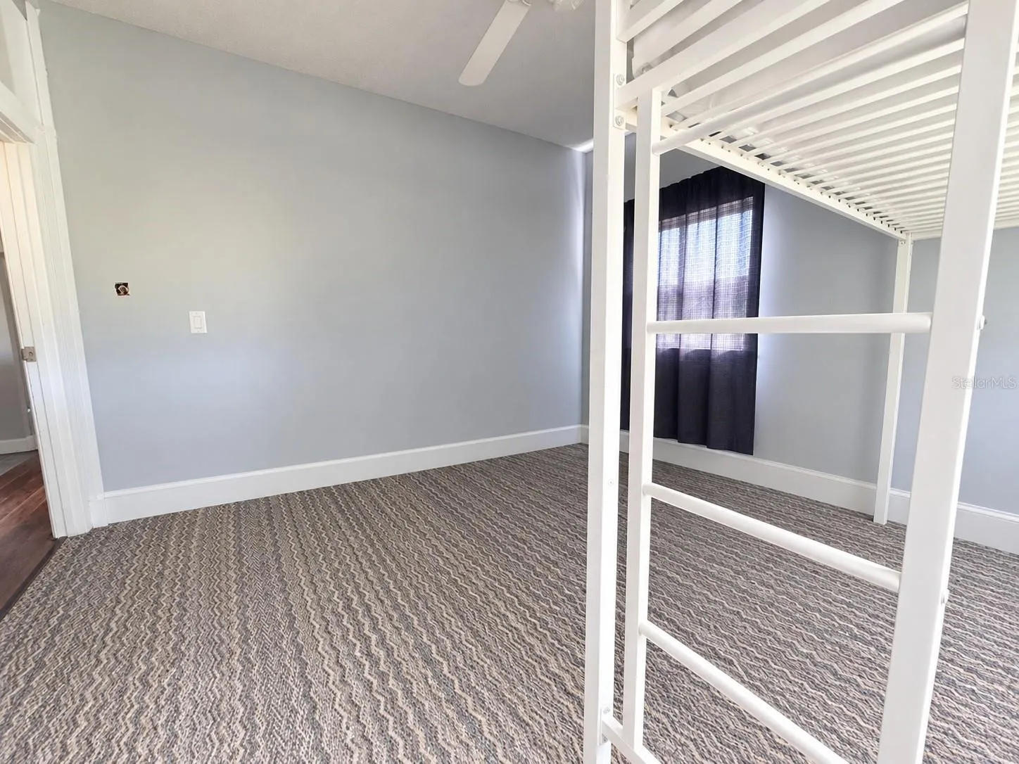 Bedroom 2 with carpet flooring