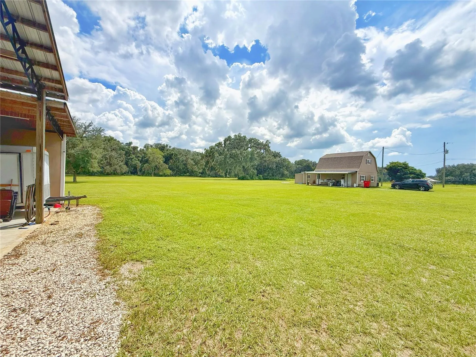 View from Pole barn of Second home and fenced in rear yard
