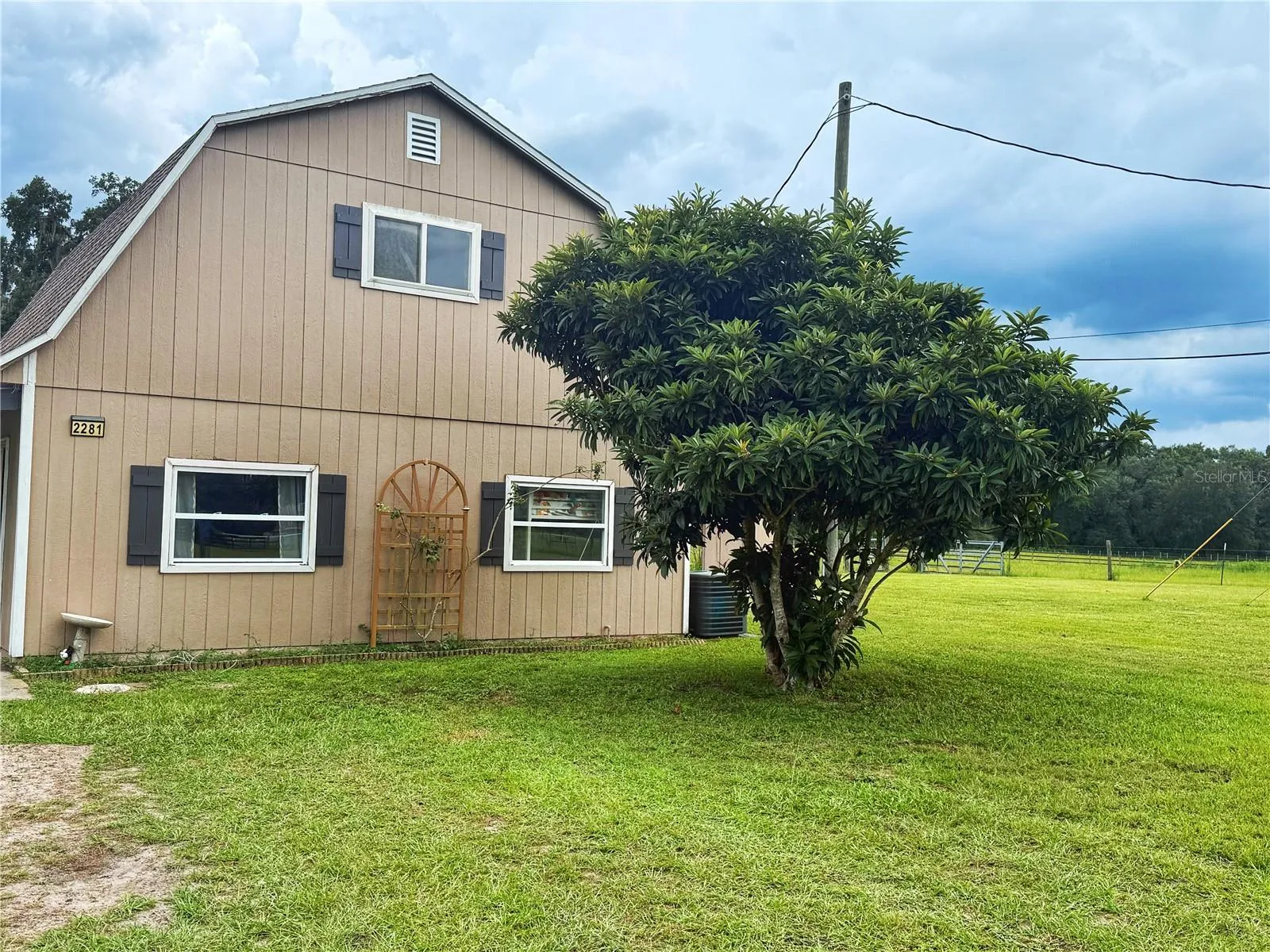 Second home with independent septic, and power. 2 bedrooms and 1 full. Agh with kitchen and living room with access from inside or separate outside entrance to upstairs office/living room/ game room or use you imagination for the spaces use.