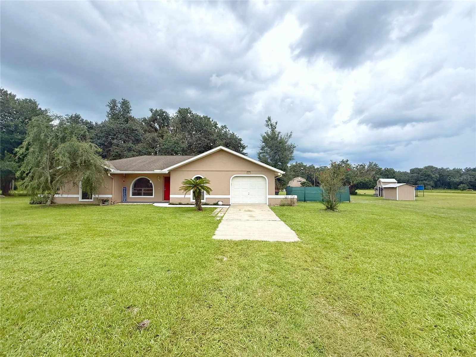 Additional view from front gate of Main home, pool area, Second home and chicken coop