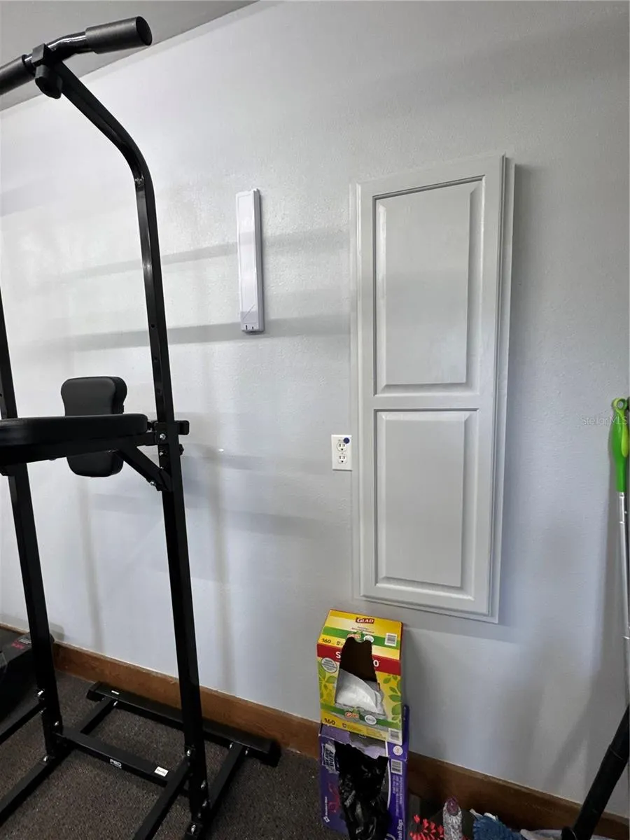 Main home garage with laundry, built in ironing board, climate controlled,