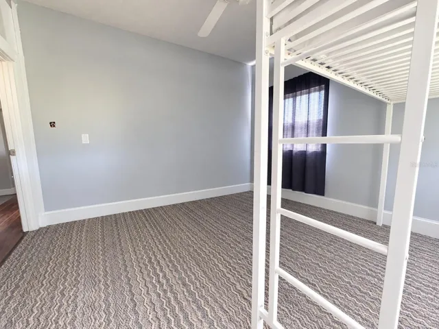 Bedroom 2 with carpet flooring