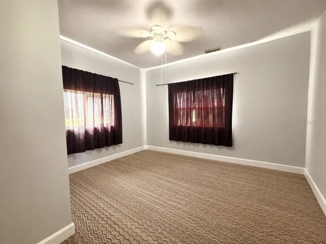 Second home- Bedroom 1 with carpet flooring