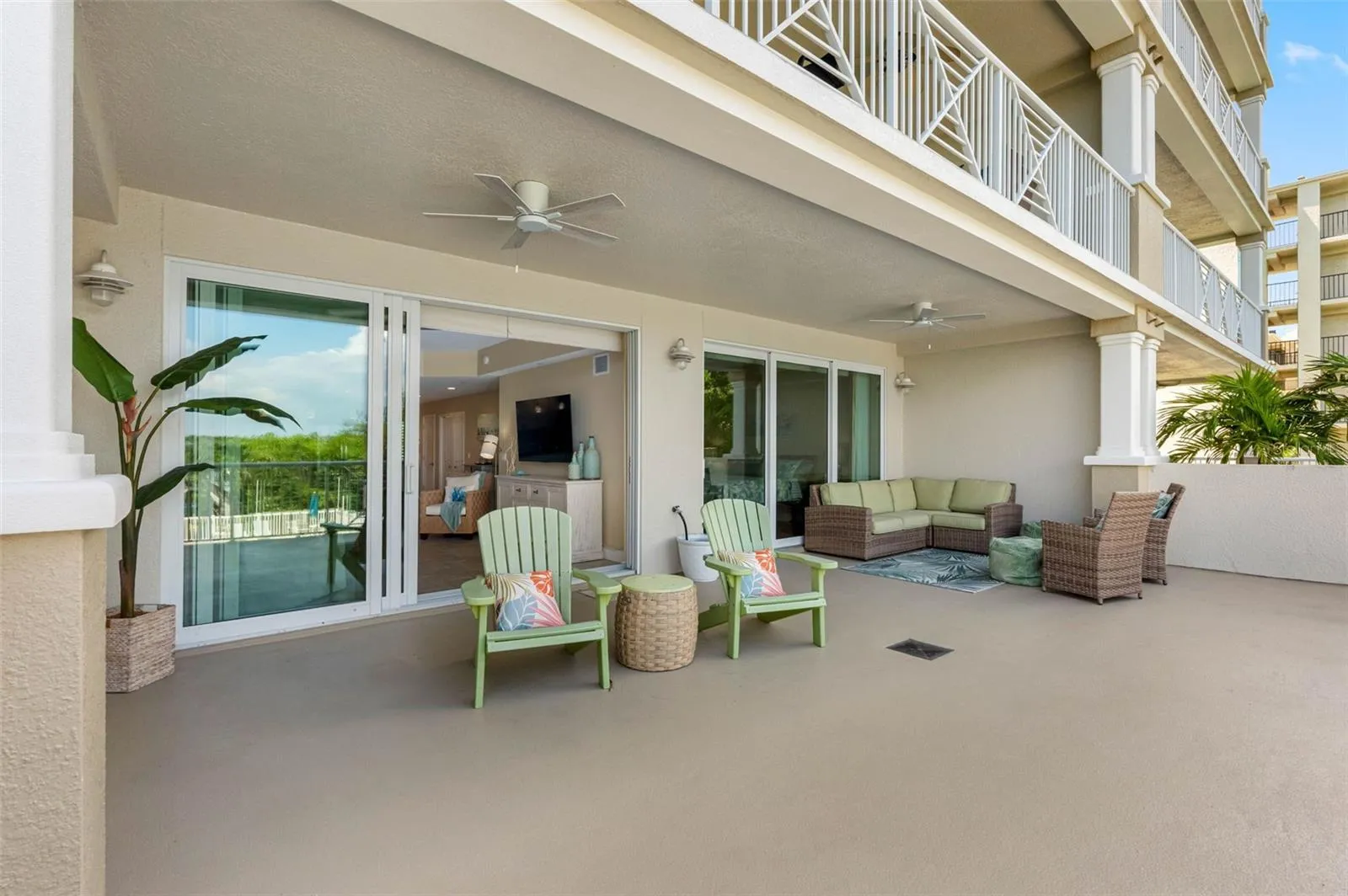 .... Photo #1 of X Large 20' x 30' Balcony Looking Back into Condo From South End. It's Akin to Having Your Own Back Yard. Half is Open and Half is Shaded. Just a Wonderful Living Space.