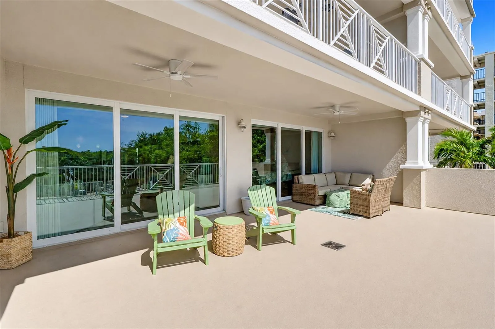 .... VIEW FROM BALCONY BACK TO LIVING ROOM &amp; MASTER SUITE.. BOTH ENTRANCES HAVE RECESSABLE TRIPLE HIGH IMPACT SLIDERS PLUS NEW CEILING FANS ON TERRACE..