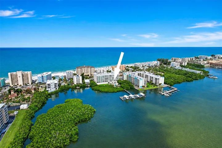 .. Residence 202 at the Dolphin Key Condo of Indian Shores Fl.. 3/2 with 1560 Sq Feet Plus an Extended  30' x 20' Waterfront Balcony. Poolside Cabana & Garage Parking Spot #1 Convey with Condo along with Outside Spot # 43.. Beach Access Right Across the Street. .. Indian Shore Florida is known as ' THE NARROWS '.. The Beach and the Intracoastal are right across from street from each other. The best of both worlds.. Our Beaches are never crowded here due to the topography of the land, there is very limited public parking - Hence no crowded Beaches..