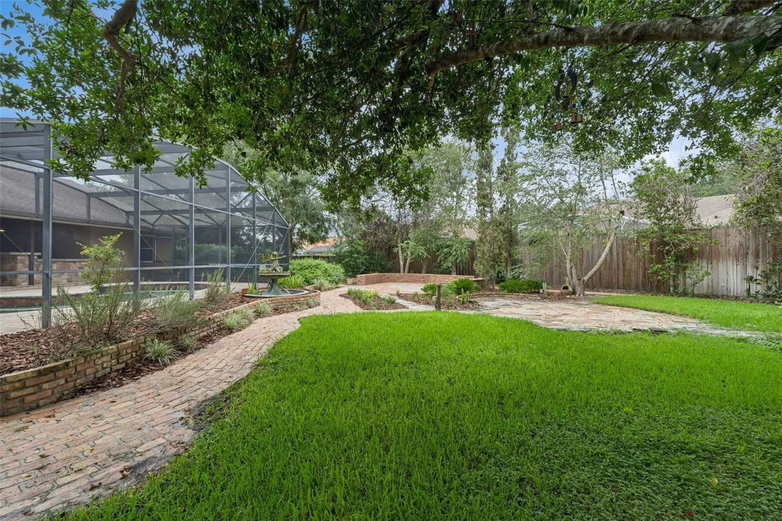 Lovely shade trees and numerous flowing plants.