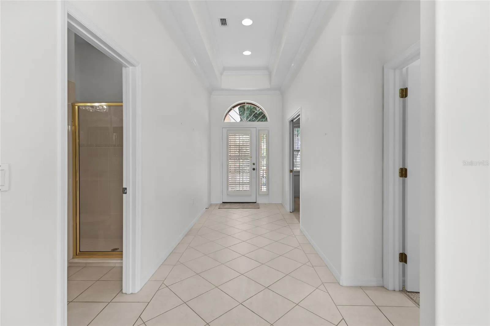 Facing the front door from end of hallway. 3rd bath is on left.