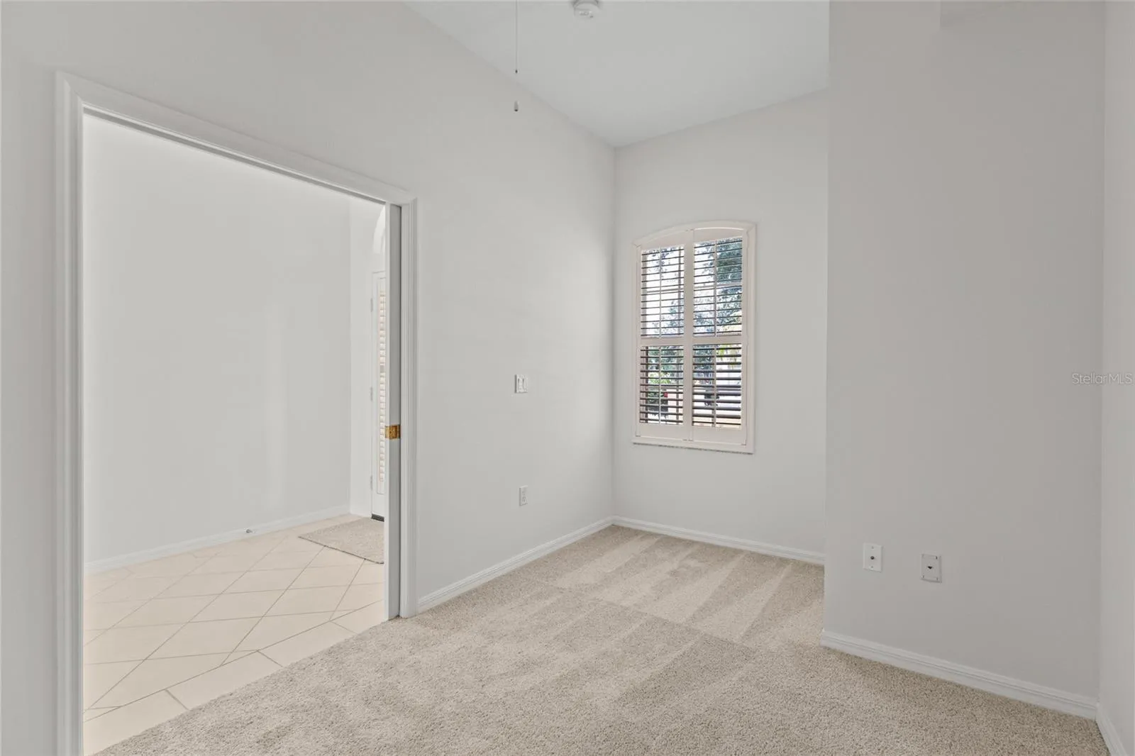 Bedroom #3 also has plantation shutters and ceiling fan