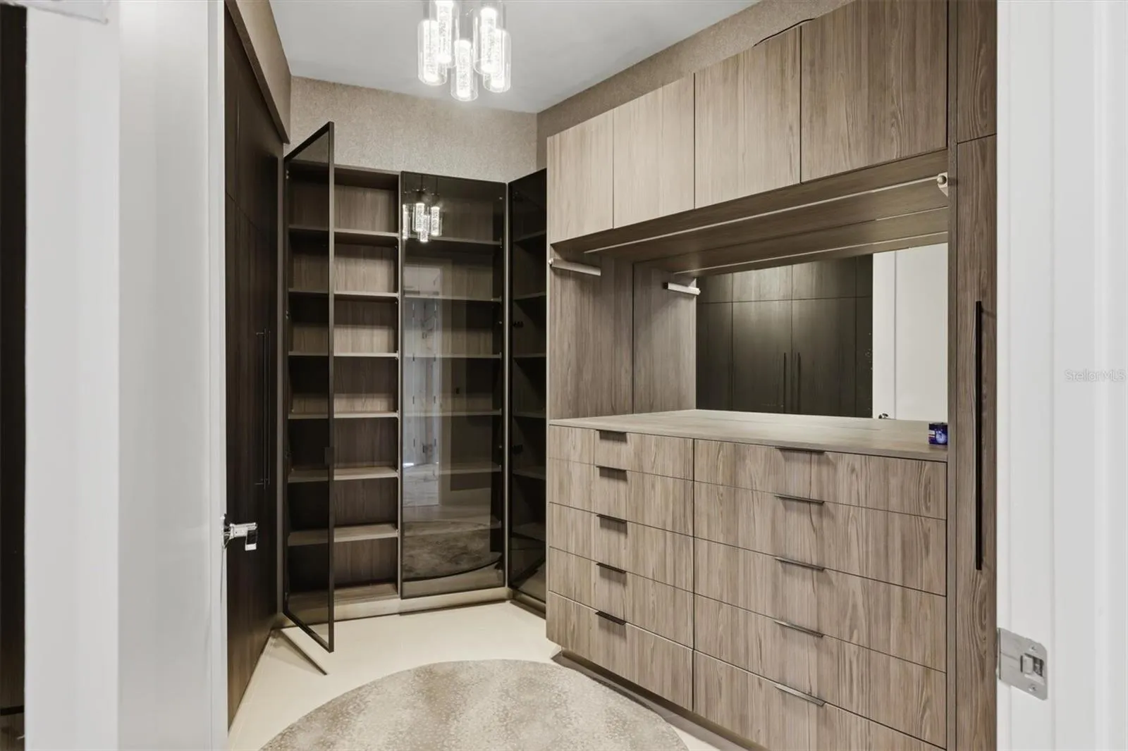 Custom-fitted closet has full-length mirror on door