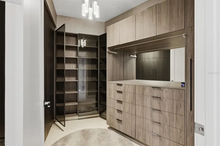 Custom-fitted closet has full-length mirror on door