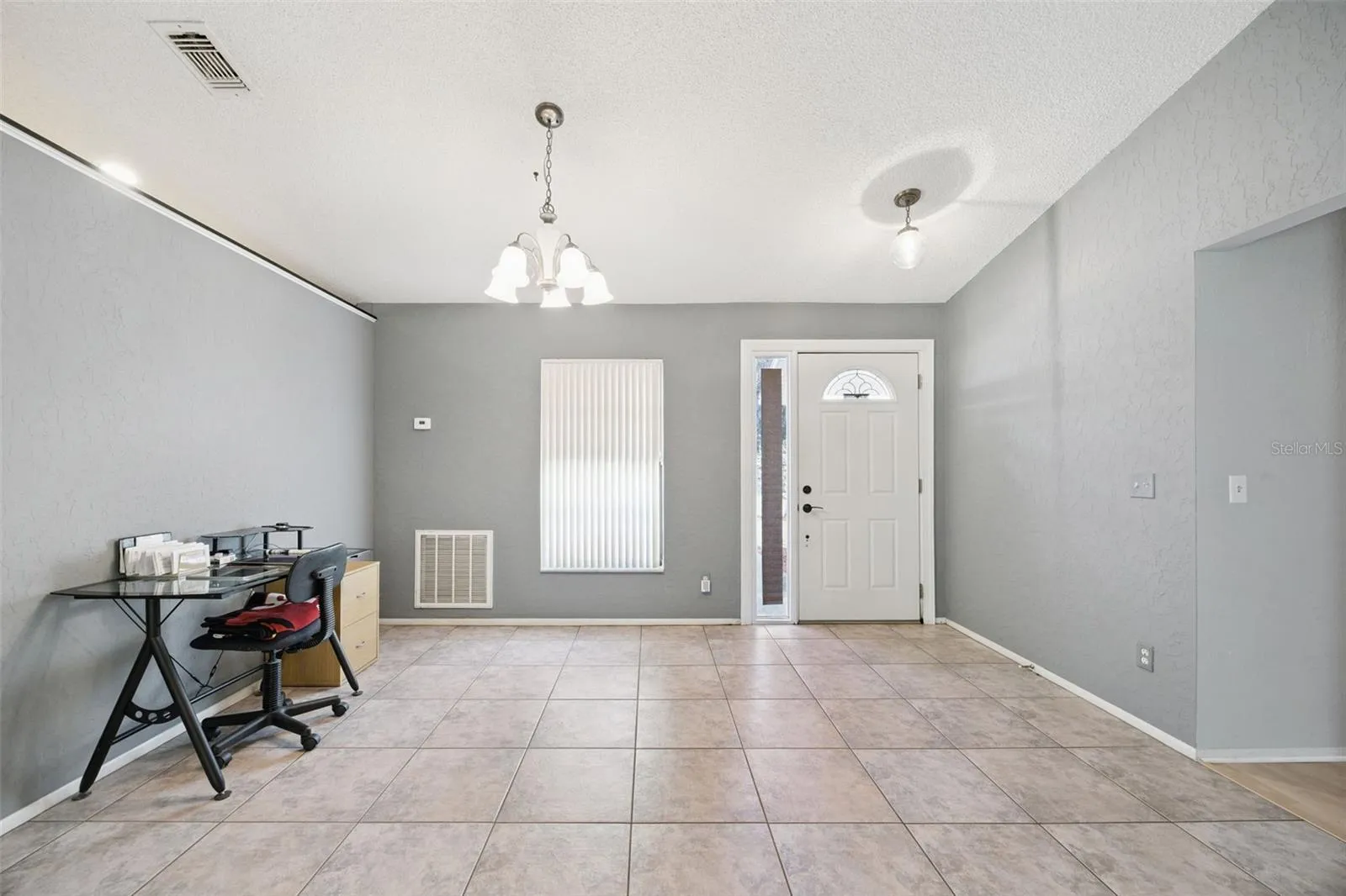 Formal Dining at entry to Living spaces.
