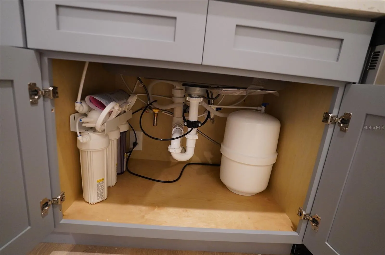 Kitchen cabinet below sink.