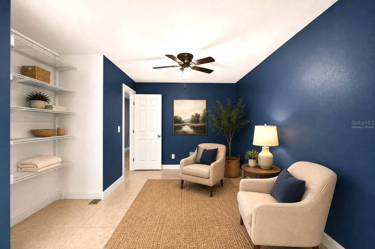 Primary bedroom sitting area virtually staged