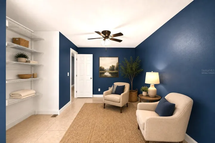 Primary bedroom sitting area virtually staged
