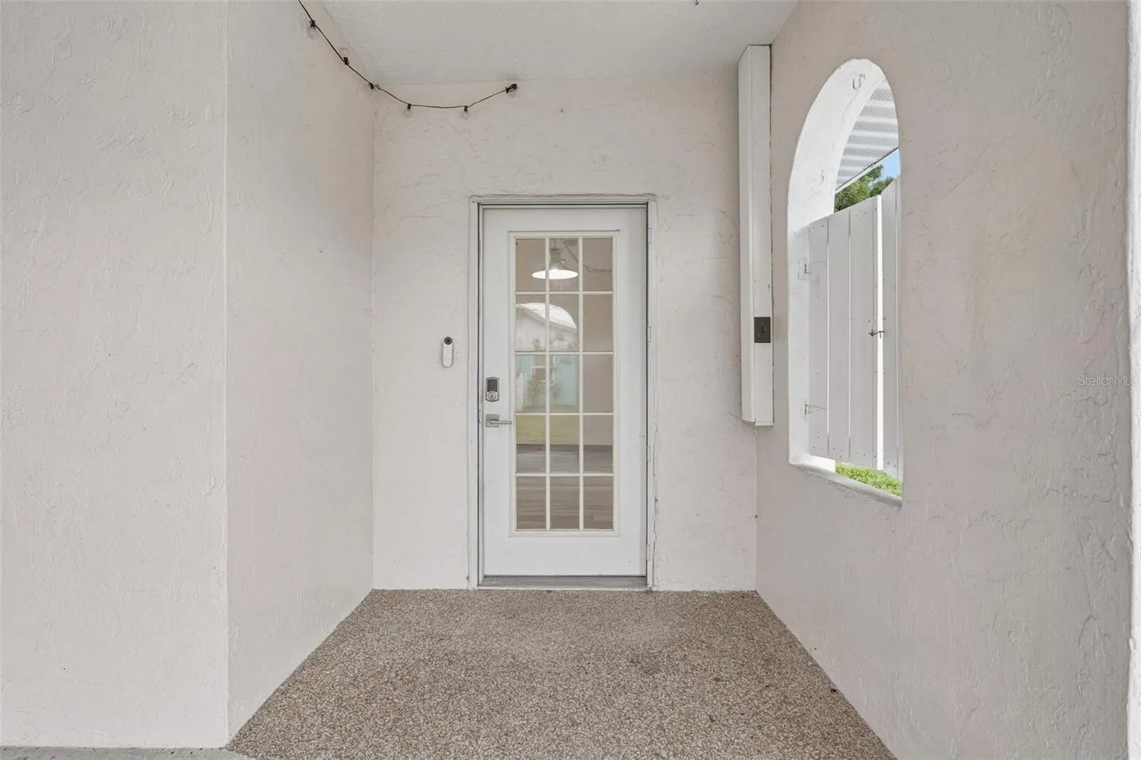 Covered Entryway with Charming Rounded Arch Detail