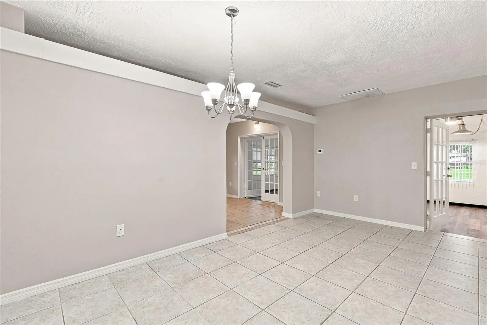 Open Dining Area Flowing Seamlessly Into Updated Kitchen