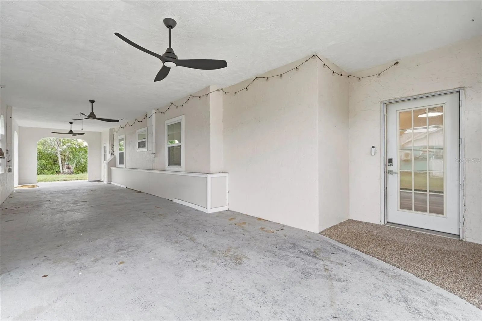 Expansive Tandem 3-Car Carport with Three Bahama Style Fans