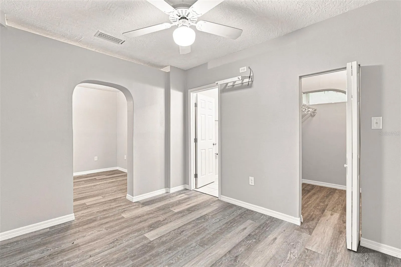 Primary Bedroom with Ensuite Access and Walk-In Closet