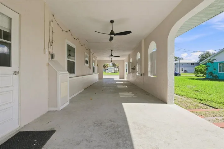 Expansive Tandem 3-Car Carport with Three Bahama Style Fans