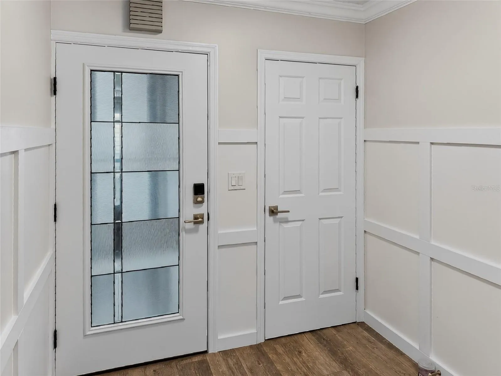 Entry door with storage closet adjacent to