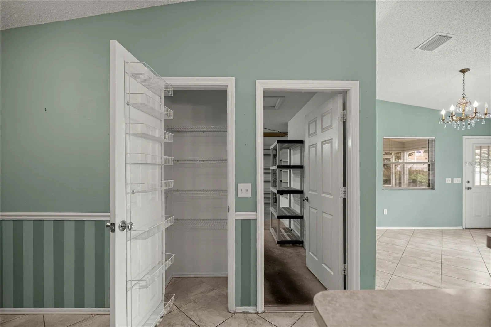 Pantry and view into the garage.