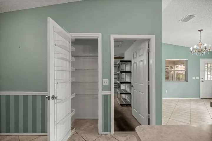 Pantry and view into the garage.