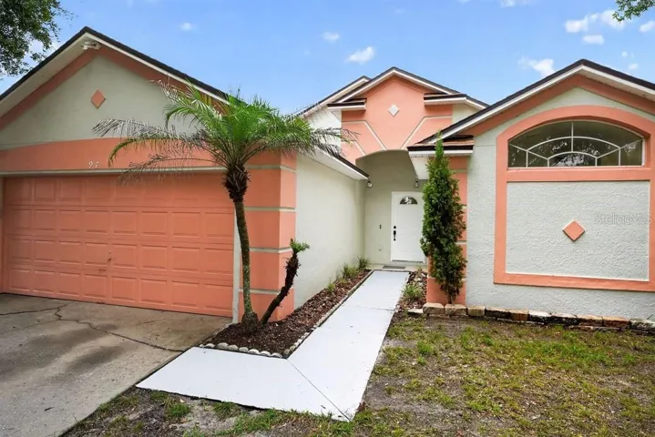 Front elevation featuring a covered entrance and attached two-car garage.