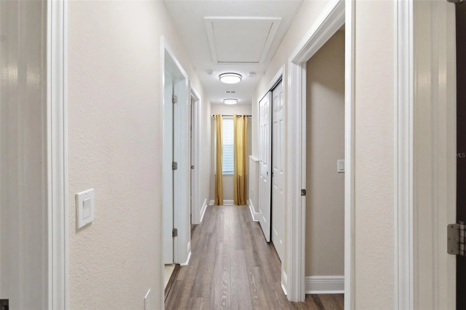 Hallway to 4 bedrooms and 2 bathrooms