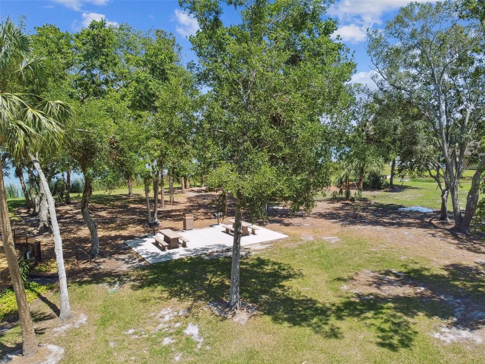 Picnic table with grill.  Also enjoy the fenced pet parks, ball and soccer fields, basketball courts, tennis/pickleball courts