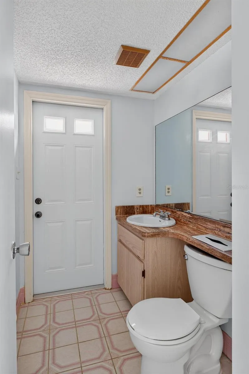 First ensuite bathroom with door to pool area