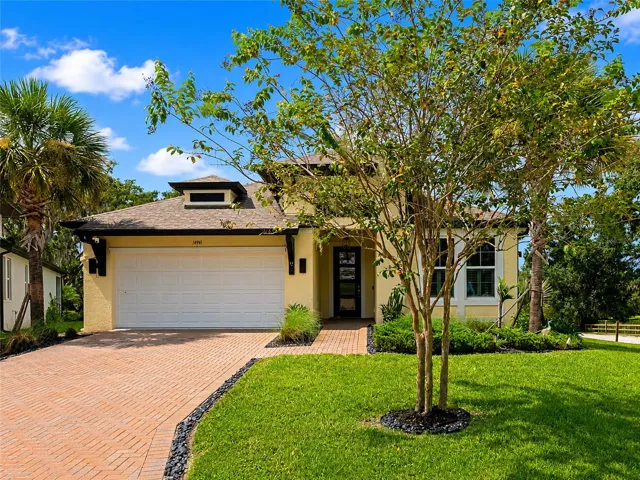 Home with paver driveway located on the culdesac