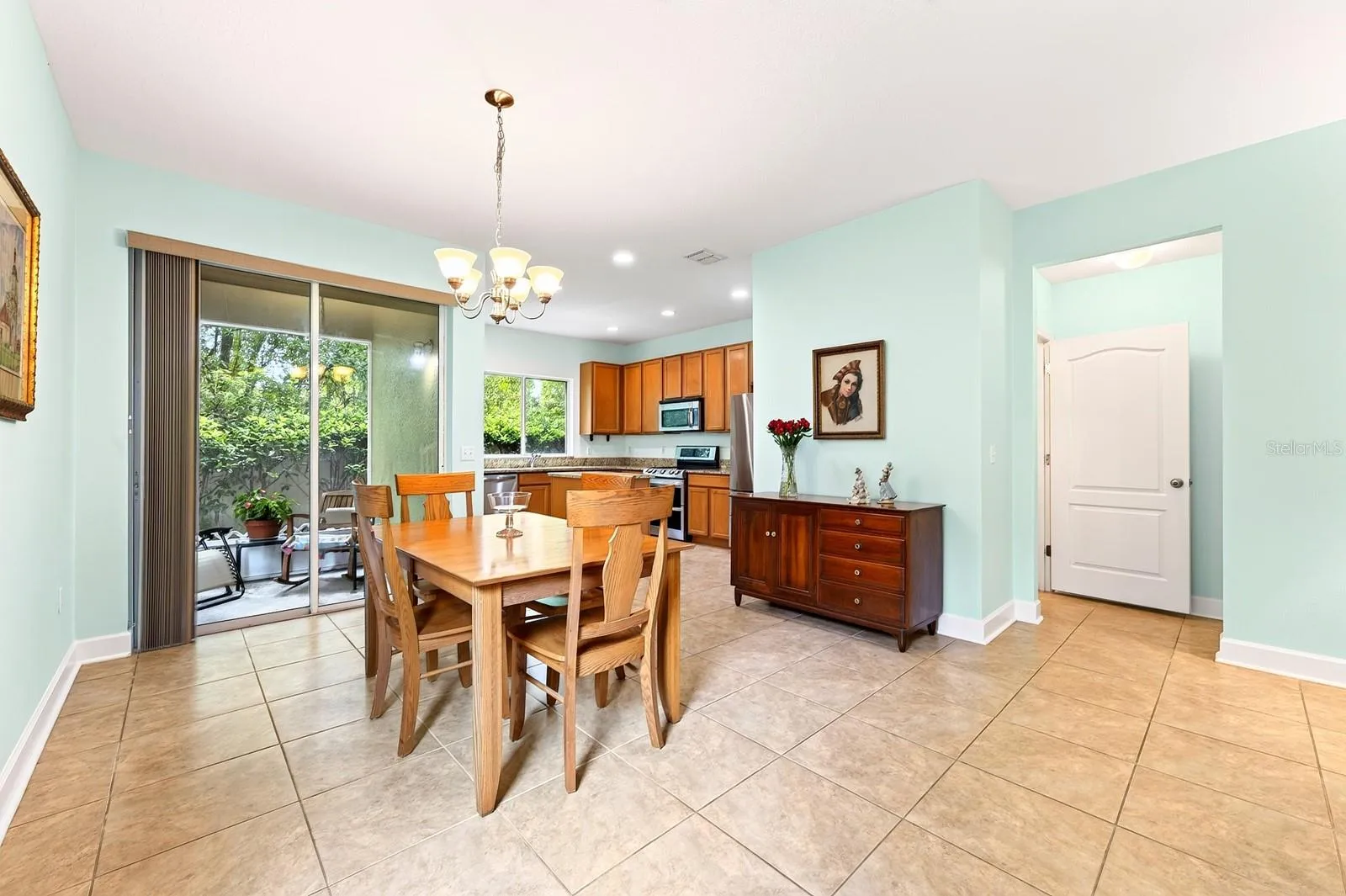 Light and bright living area is open to the dining area and spacious kitchen.