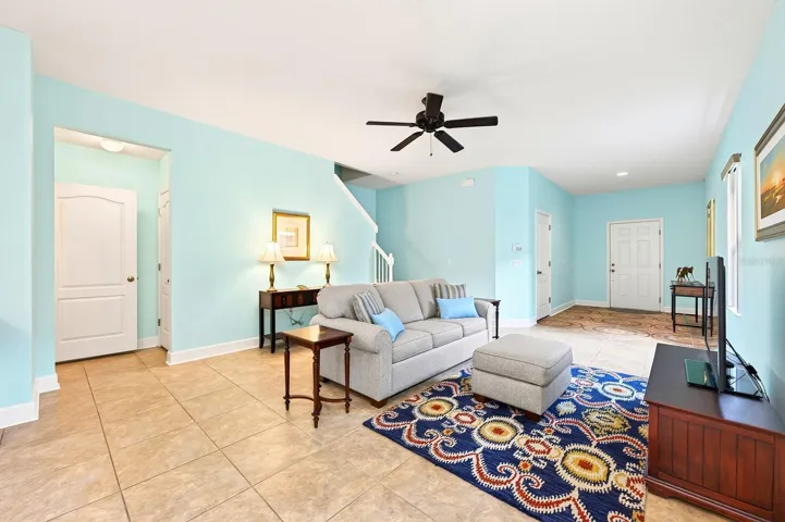 A paver driveway, covered front entry, and attractive curb appeal welcome you inside, where TILE FLOORING throughout the main level and an OPEN CONCEPT layout create a light, bright atmosphere perfect for everyday living.