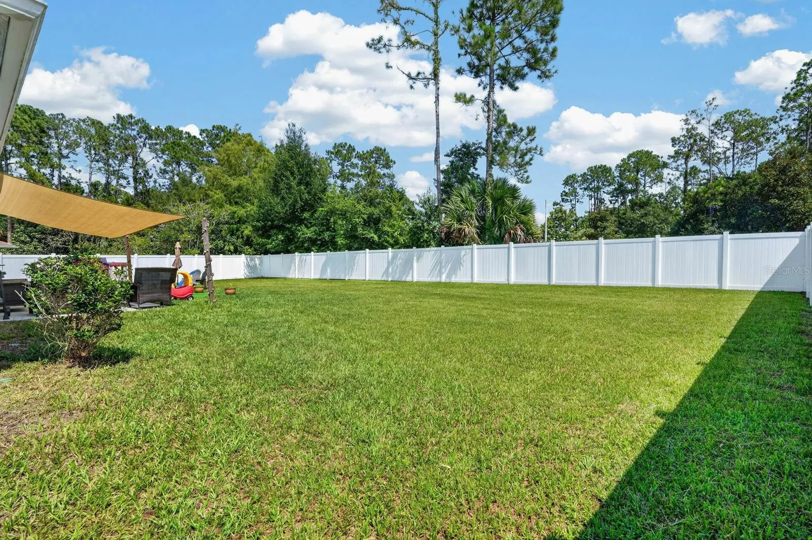 The backyard backs to green space for extra feel of privacy