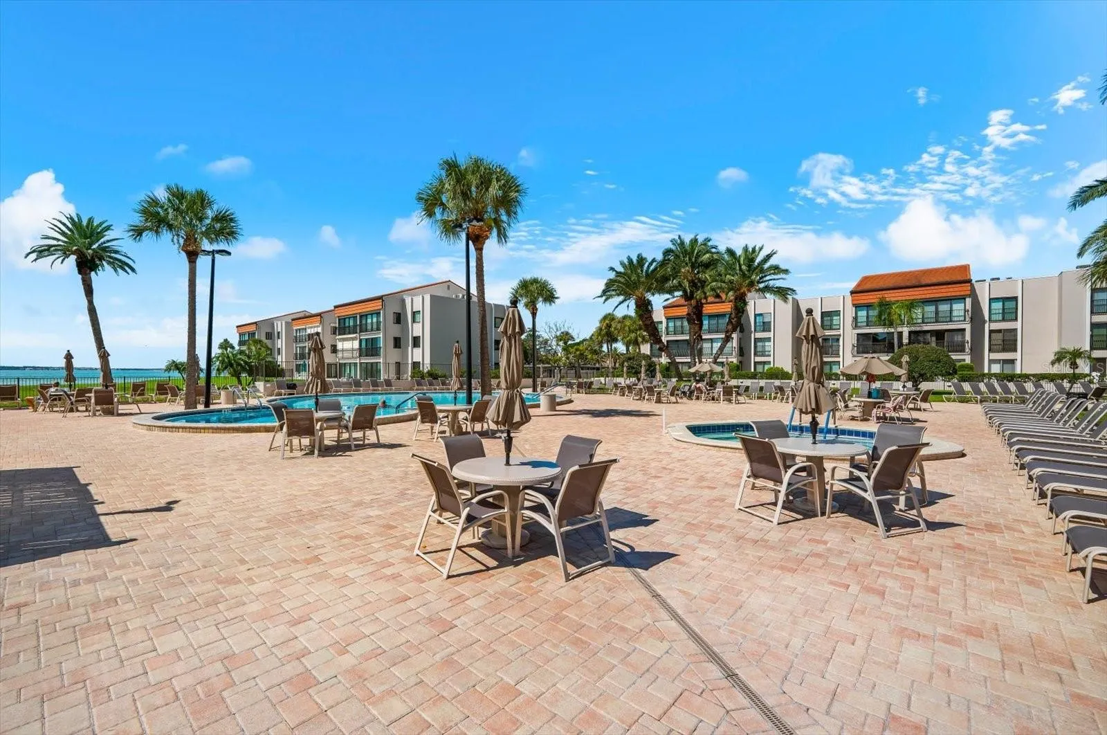 Pool are is large with plenty of seating and is close to the private beach area